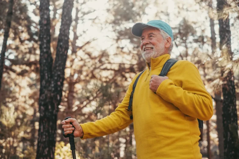 Middle aged man happy walking in nature