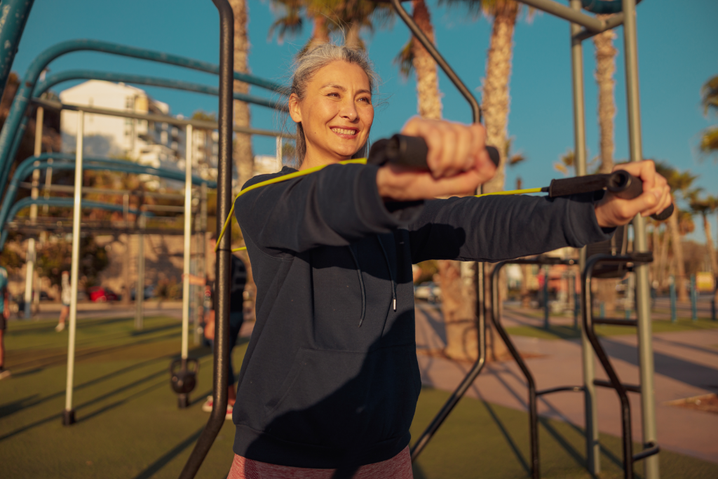 Default ALT text for sporty-woman-exercising-outside-with-rubber-bands-2026-03-10-01-09-47-utc